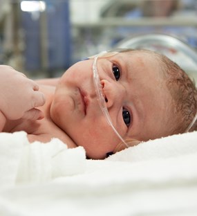 Baby with breathing mask