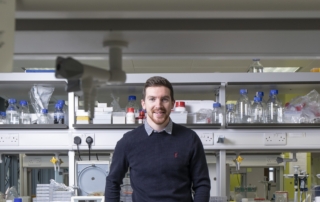 Dr Mark OSullivan, a lead investigator at INFANT, standing in a lab with electrical engineering equipment